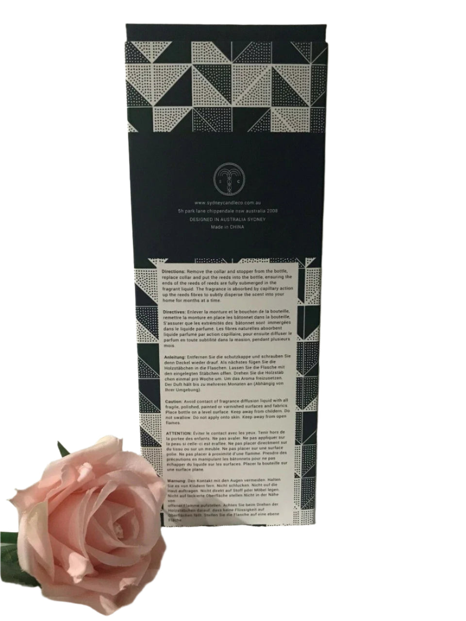 Emerald Balsam reed diffuser in clear glass bottle with natural reeds