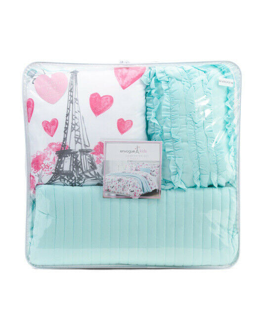 Teal quilt with Eiffel Tower and heart design in packaging.