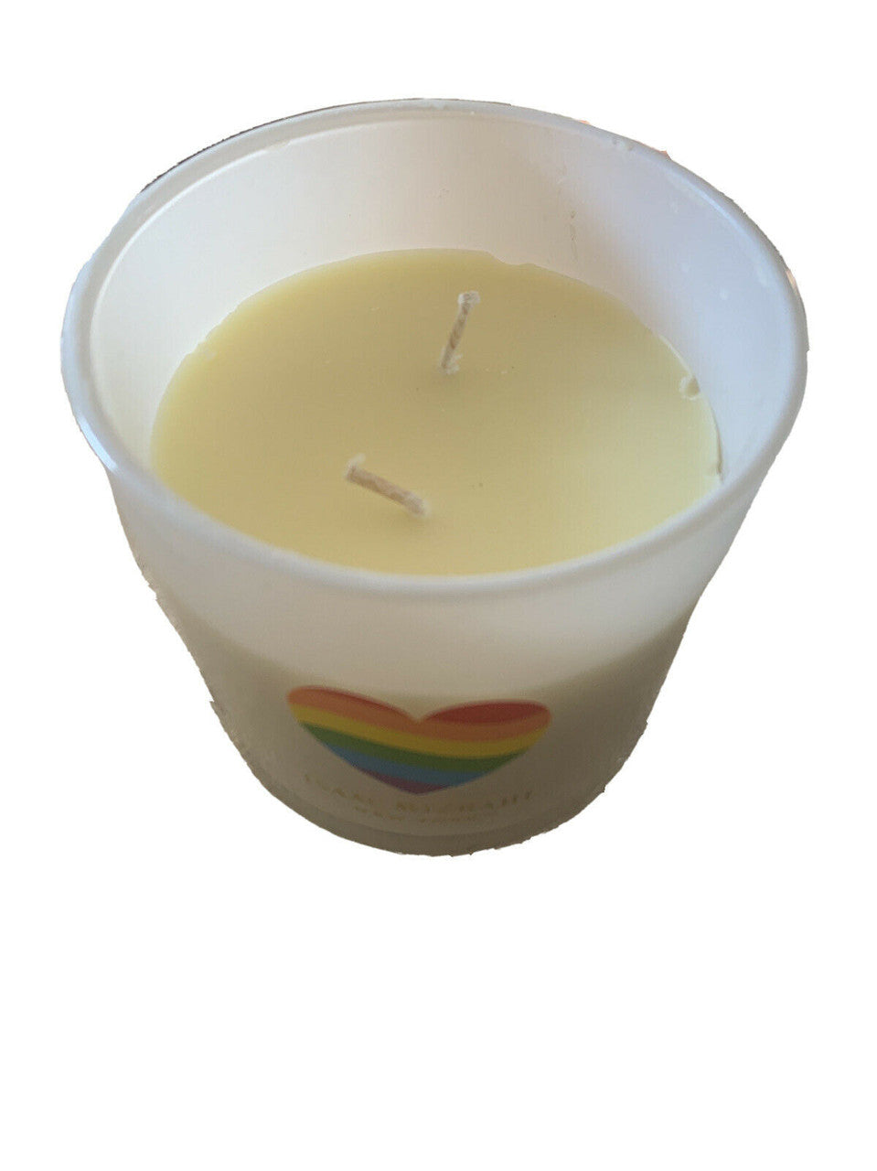 Isaac Mizrahi New York Paradise 12oz scented candle in soy blend, with colorful box and heart logo on the jar.