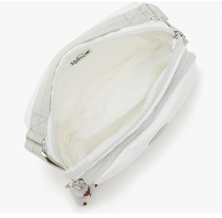 Small white crossbody nylon bag with front zip pocket and plush keychain charm