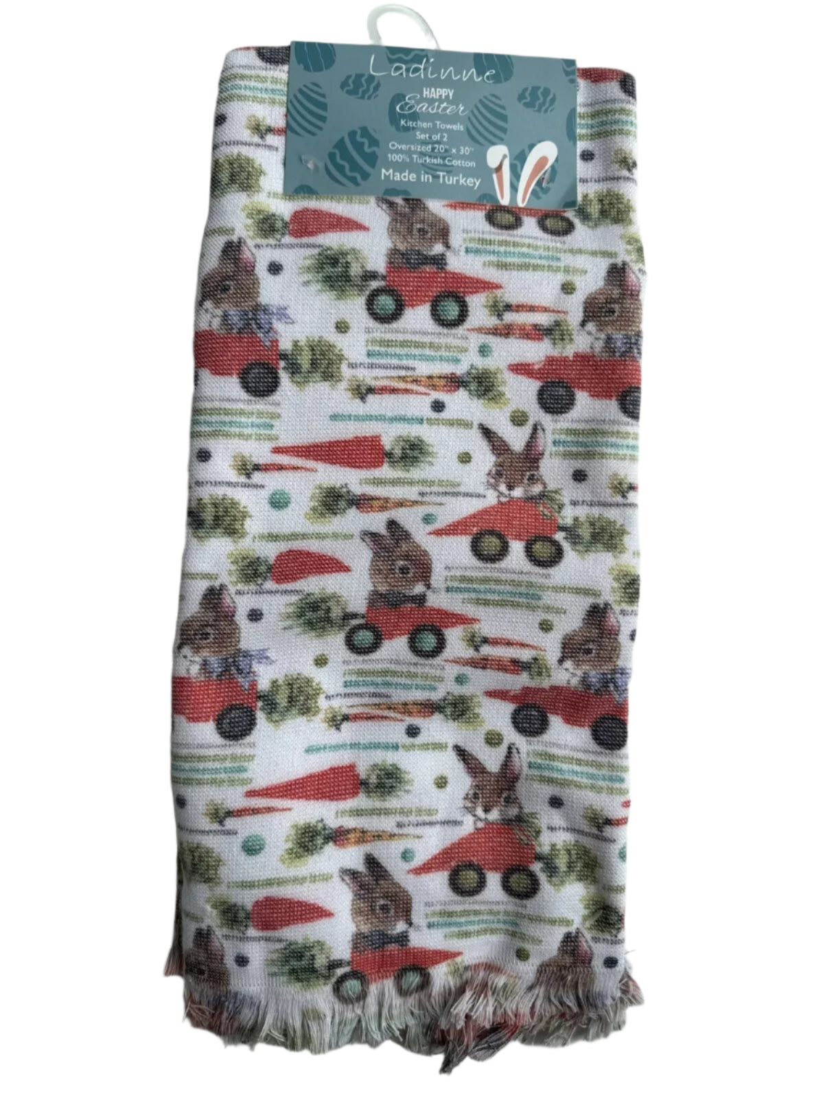 Pair of Easter-themed oversized kitchen towels with bunny and red truck design on white background.