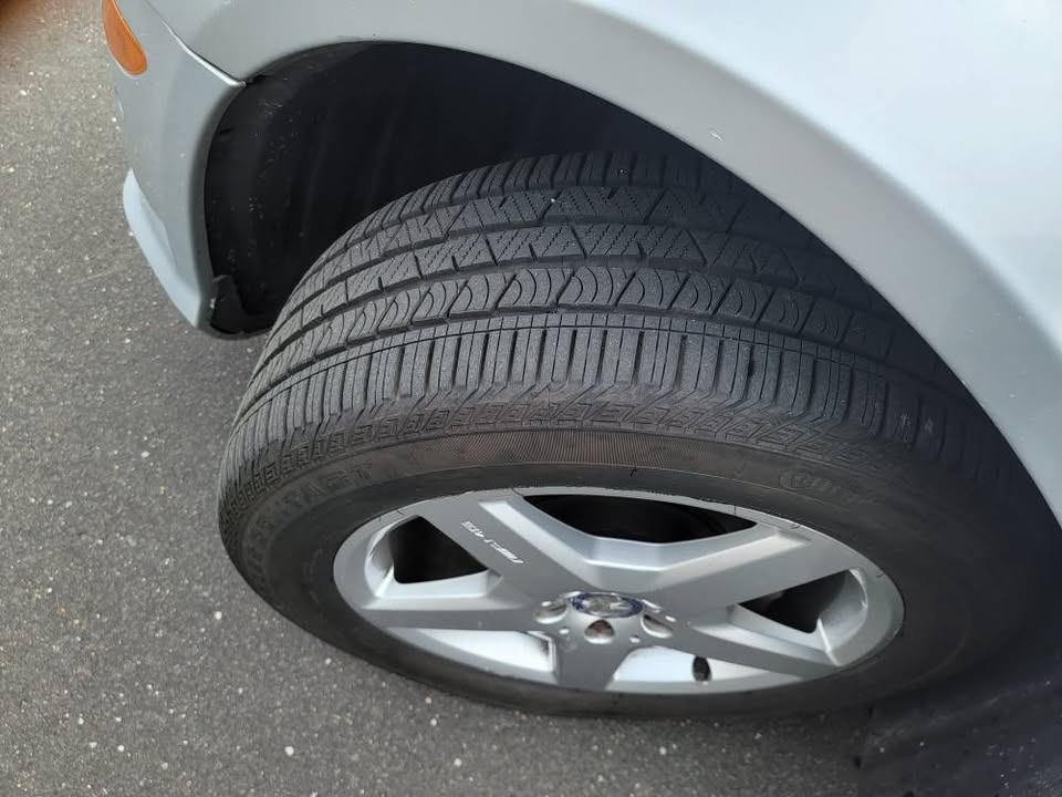 Close-up of front tire and alloy wheel on Mercedes R350, good tread visible