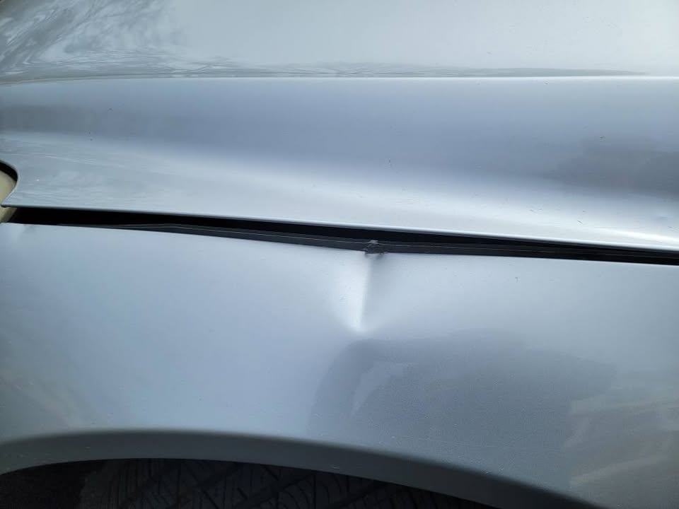 Driver side mirror and trim detail of Mercedes R350 AWD silver exterior