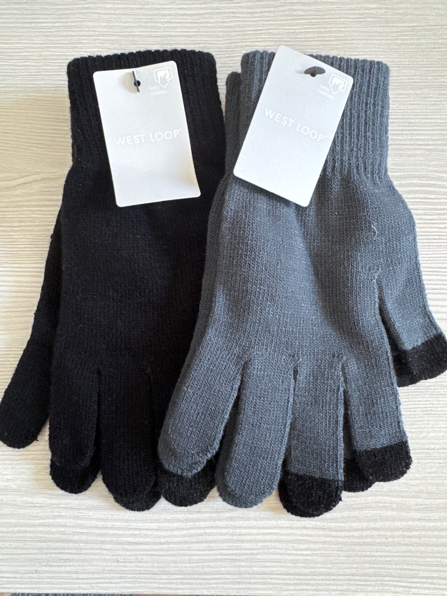 Two pairs of West Loop touchscreen gloves in gray and black, one-size knit style with touch-capable fingertips