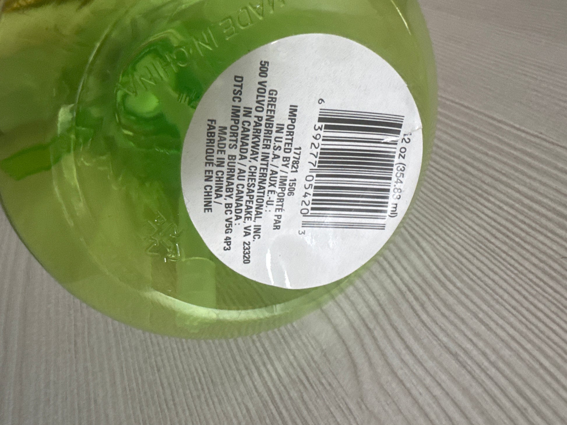 Green plastic spray bottle with trigger sprayer