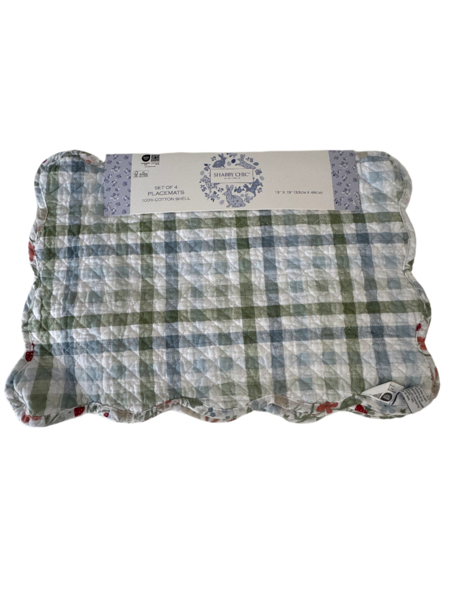 A set of 4 placemats in a green and blue plaid pattern, featuring a scalloped edge and a "Shabby Chic" label on the packaging