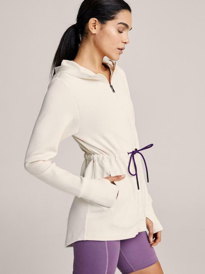 Women’s lightweight zip hoodie in ivory with adjustable drawstring waist and thumbholes