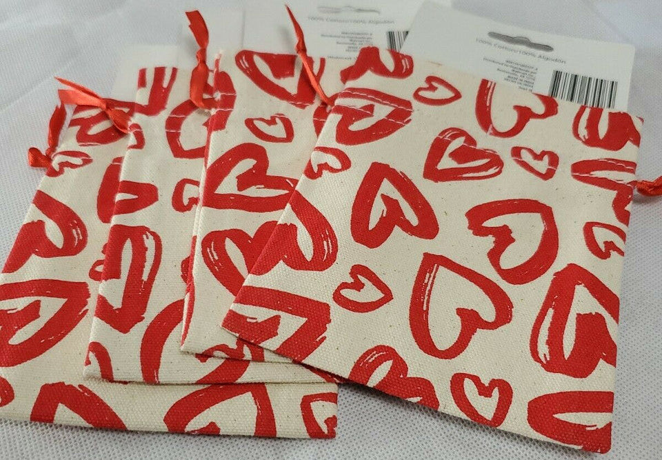 Four small burlap style Valentine drawstring treat bags with red hearts, size 4.72 x 6.02 inches.