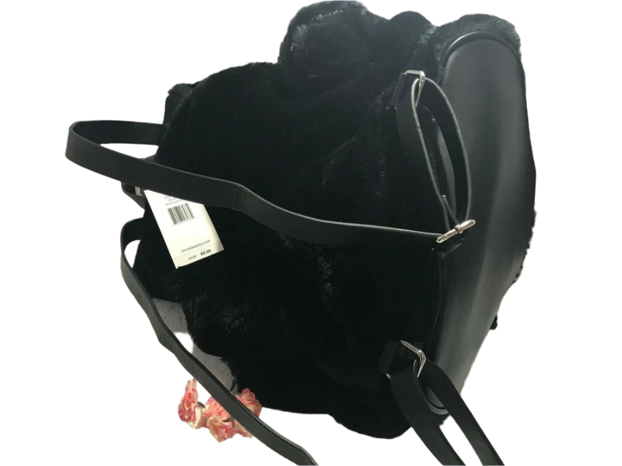 Steve Madden medium black faux fur backpack with decorative pin, side pockets, and drawstring flap