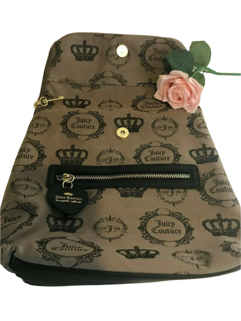 Beige and black canvas backpack with gold Juicy Couture logo and medallion design