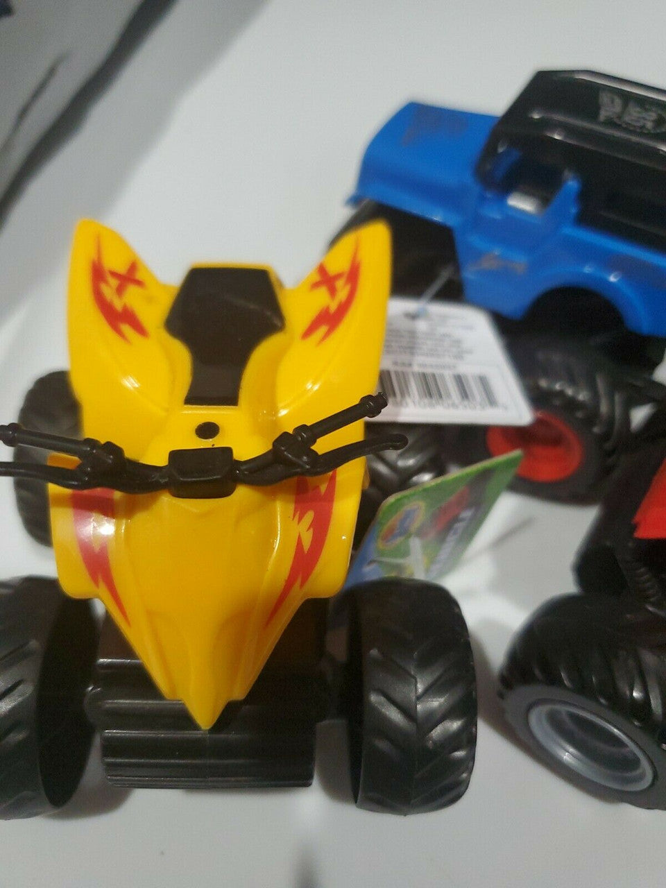 Friction powered 4WD jeep and monster truck toy set in packaging