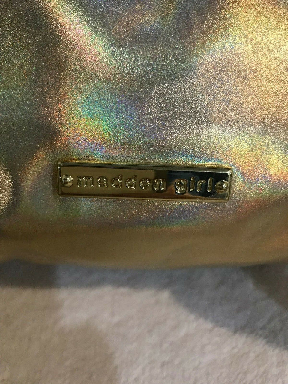 Madden Girl MG-3115 gold metallic faux leather backpack with front buckle and drawstring