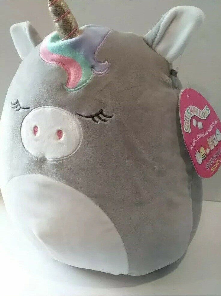 Plush toy unicorn with a tag on a white background
