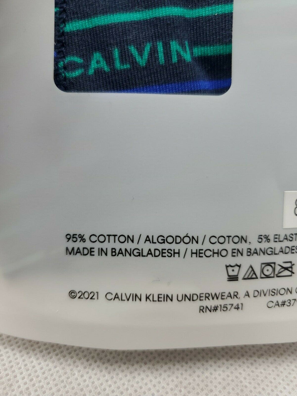 Calvin Klein boy’s boxer briefs, 2-pack cotton stretch underwear in size S (6-7), black/navy and stripe, shown in original packaging.