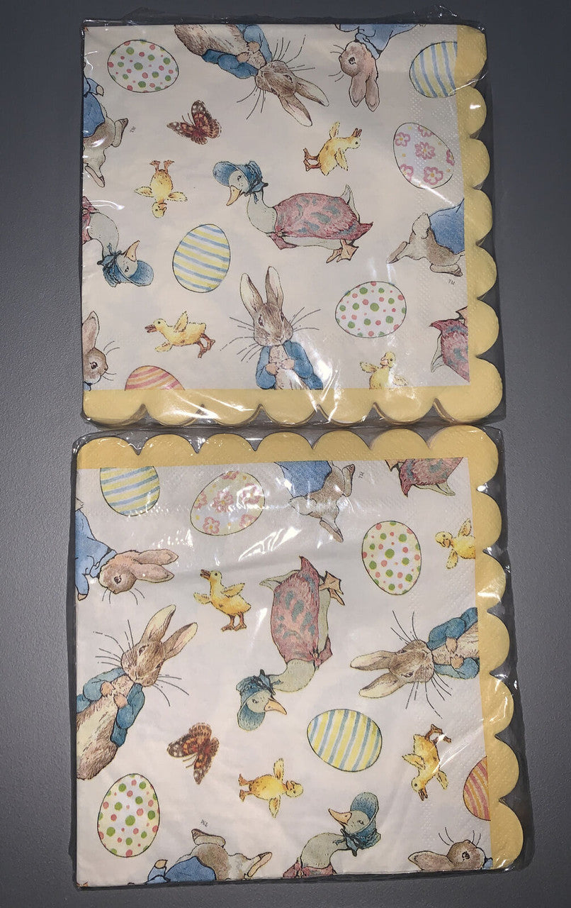 Two packs of Easter cocktail napkins featuring Peter Rabbit illustrations by Beatrix Potter in pastel spring designs