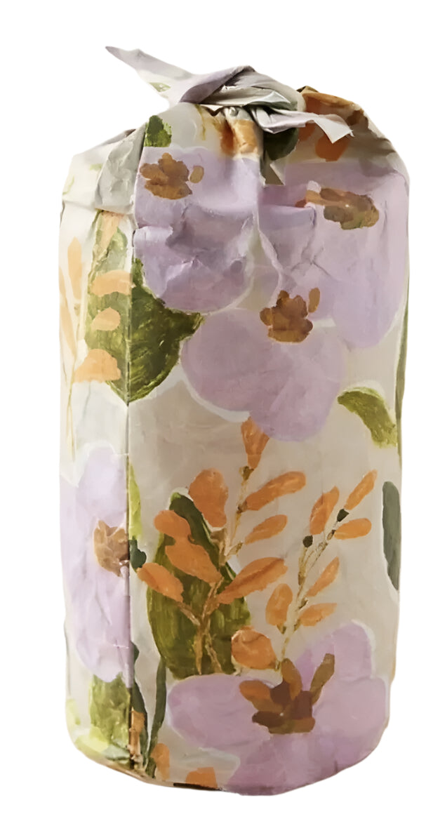 Illume Pomegranate Peony Soy Candle in floral glass jar, 12.6 oz, gift-wrapped in printed tissue.