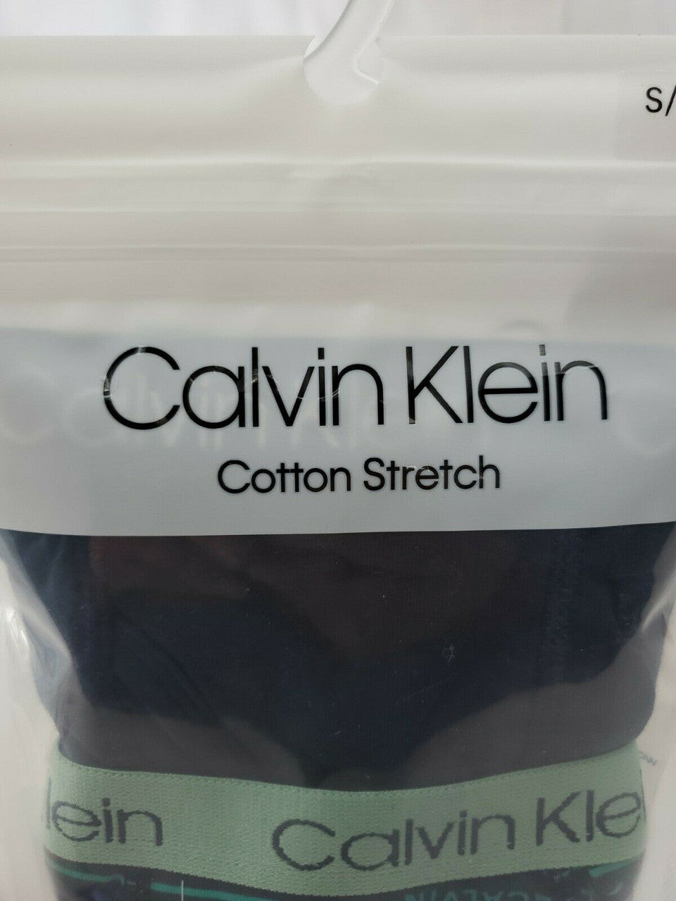 Calvin Klein boy’s boxer briefs, 2-pack cotton stretch underwear in size S (6-7), black/navy and stripe, shown in original packaging.