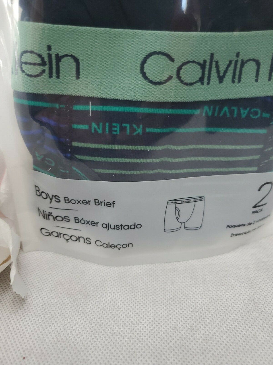 Calvin Klein boy’s boxer briefs, 2-pack cotton stretch underwear in size S (6-7), black/navy and stripe, shown in original packaging.