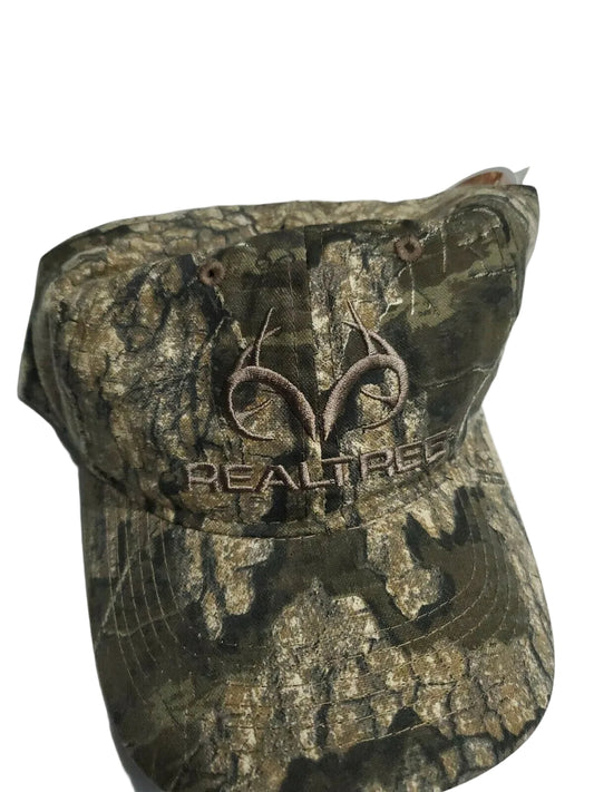 A multicolored green camo baseball cap with the REALTREE logo on the front.