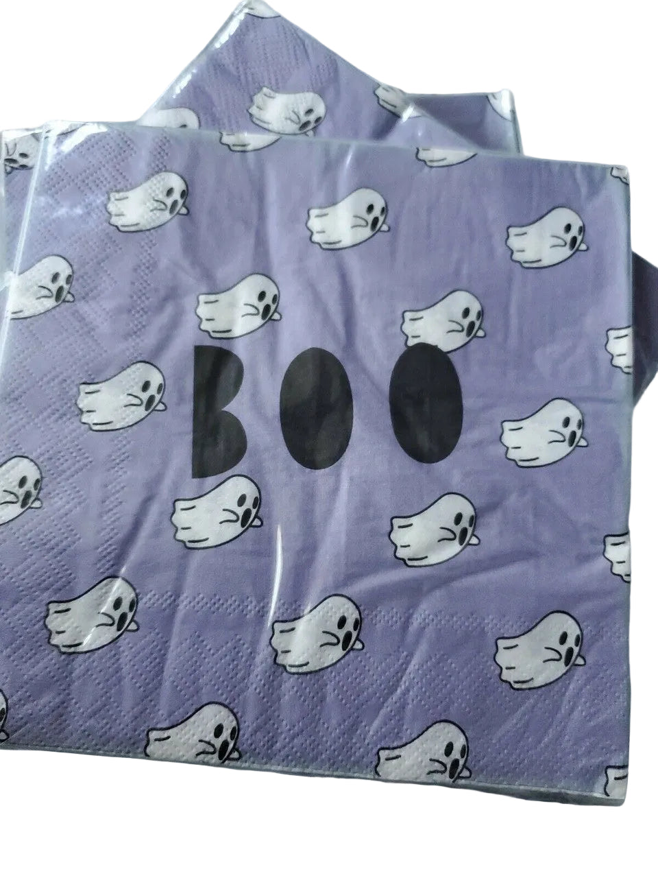 Stack of purple Halloween paper napkins with white ghost and BOO design in packaging
