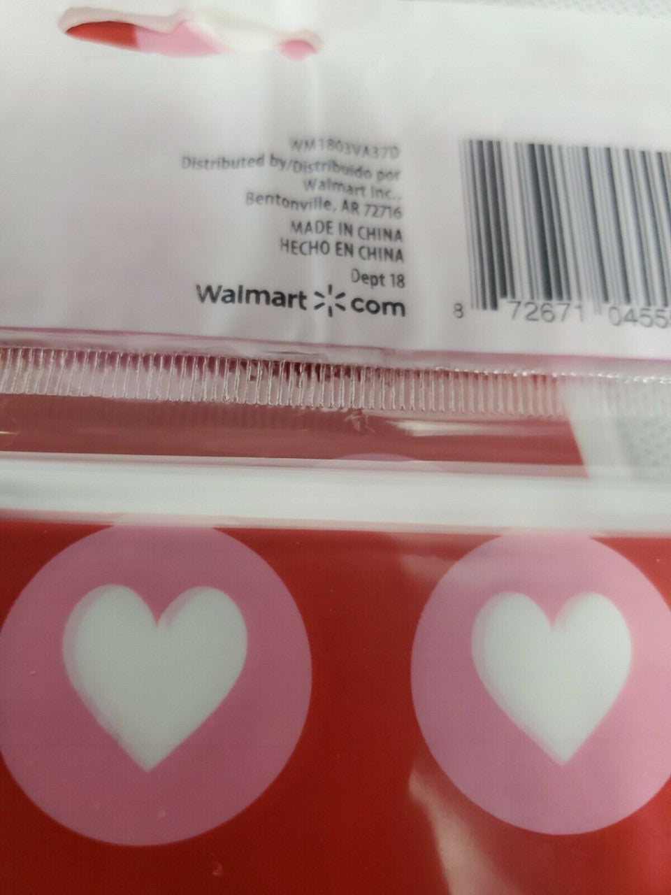 Red Valentine’s Day treat bags with white hearts, twelve retail packs with fifteen bags each and matching twist ties.