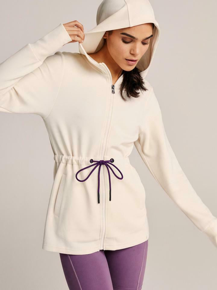 Women’s lightweight zip hoodie in ivory with adjustable drawstring waist and thumbholes