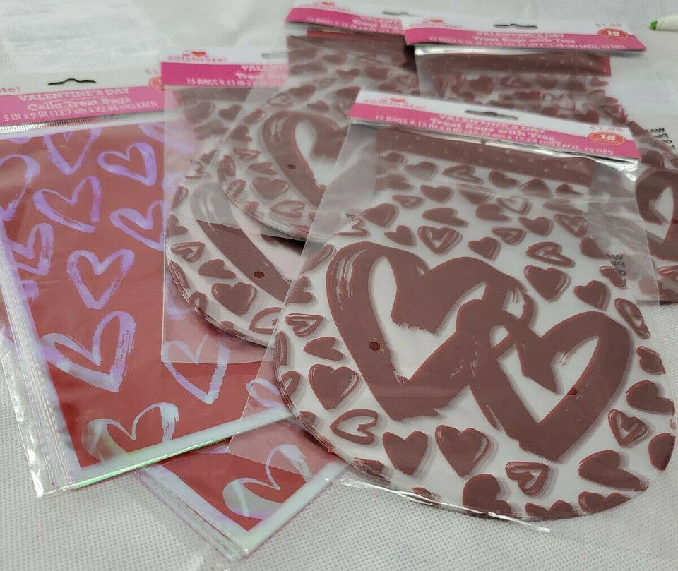Packaged heart-patterned items on a white background