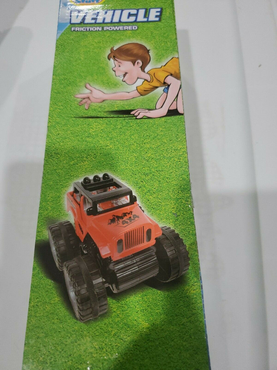 Packaging for a friction powered plastic 4WD Jeep & Monster Truck Set showing the toy truck on grass with a child in the background.