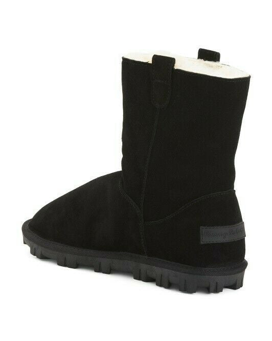 Black boot with white lining on a white background