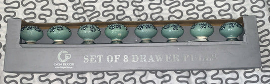 A set of 8 ceramic drawer pulls with a green and blue floral pattern, packaged in a gray box with the Casa Decor logo.