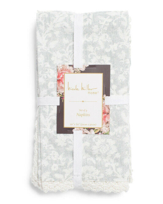 Set of four Angelica lace trim cotton dinner napkins by Nicole Miller folded and packaged