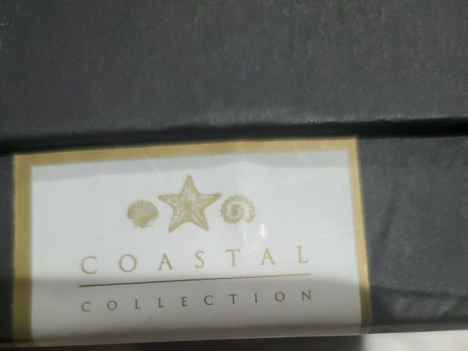 Set of four silver rhinestone turkey napkin rings displayed in black gift box