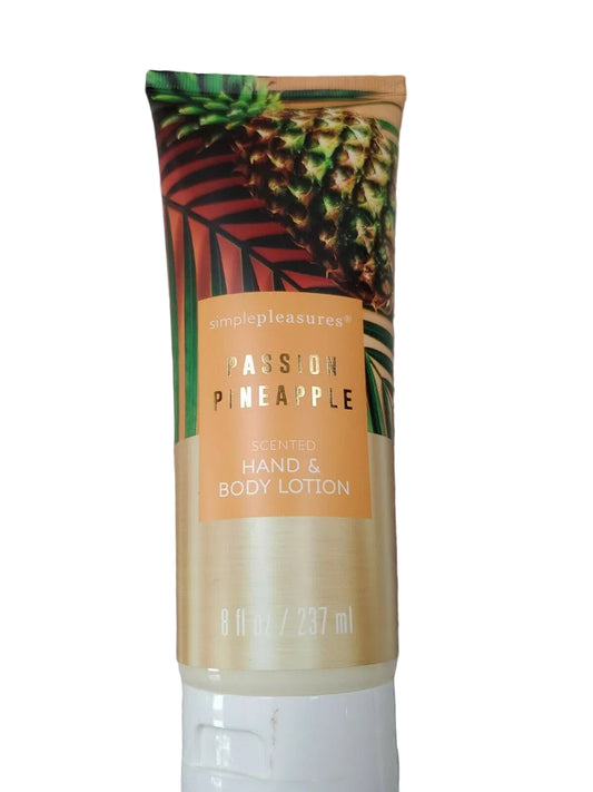 A tube of Simple Pleasures Passion Pineapple Hand Body Lotion with a beige background and tropical design elements, including pineapples and leaves.