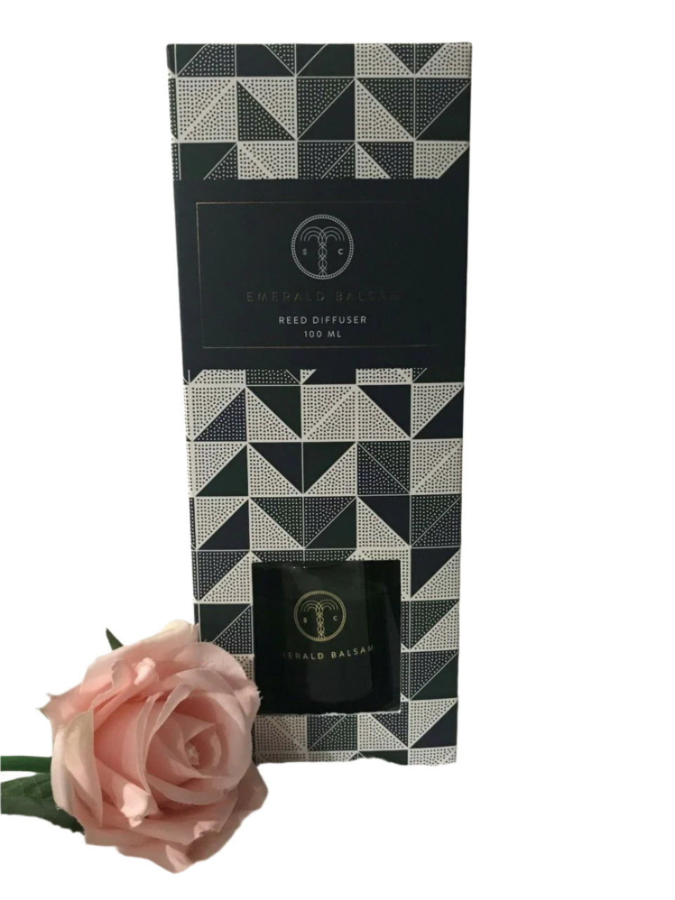 Emerald Balsam reed diffuser in clear glass bottle with natural reeds