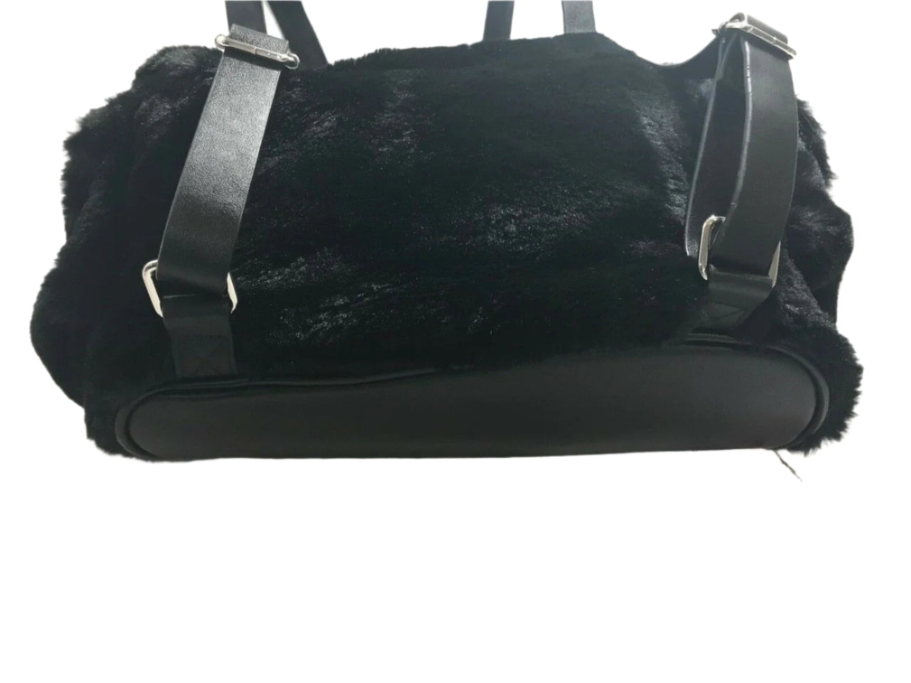 Steve Madden medium black faux fur backpack with decorative pin, side pockets, and drawstring flap