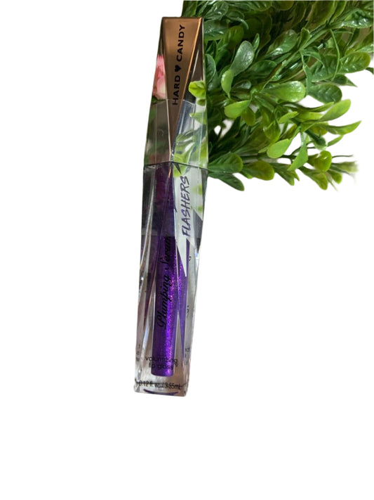 Hard Candy Dazzled #1378 lip plumping gloss in purple – sealed tube on floral background