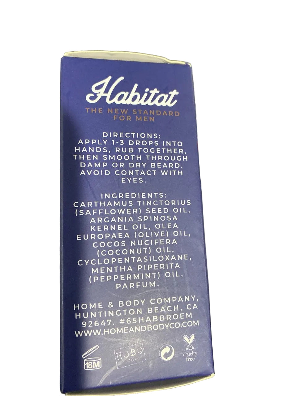 Blue packaging with text and product details on a dark background.
