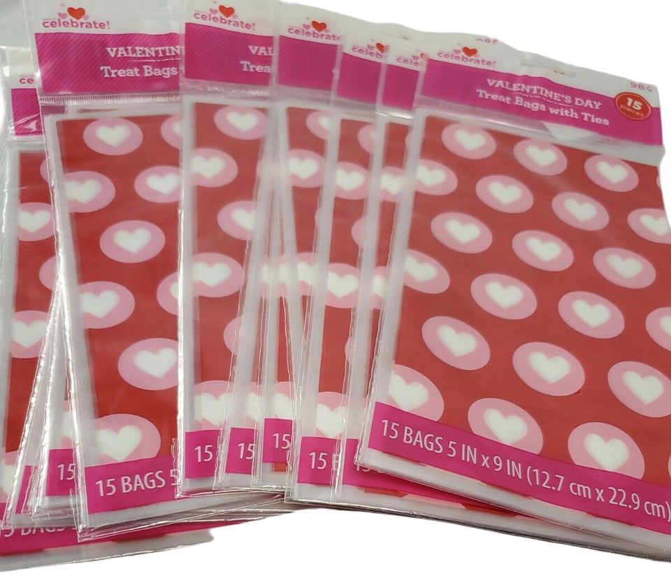 Red Valentine’s Day treat bags with white hearts, twelve retail packs with fifteen bags each and matching twist ties.