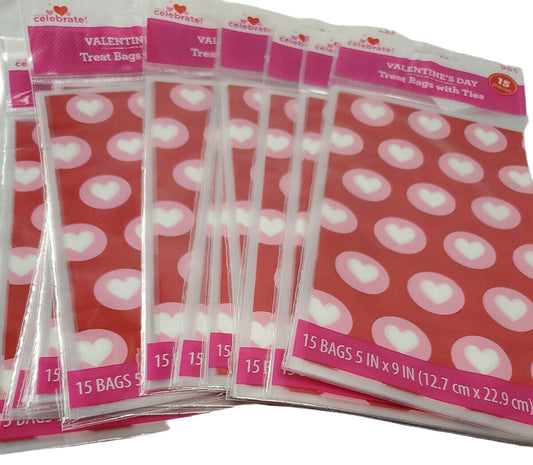 Red Valentine’s Day treat bags with white hearts, twelve retail packs with fifteen bags each and matching twist ties.