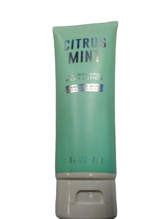 A bottle of Simple Pleasures Citrus Mint Conditioning Scented Hand Lotion with a green label and white dispenser base.