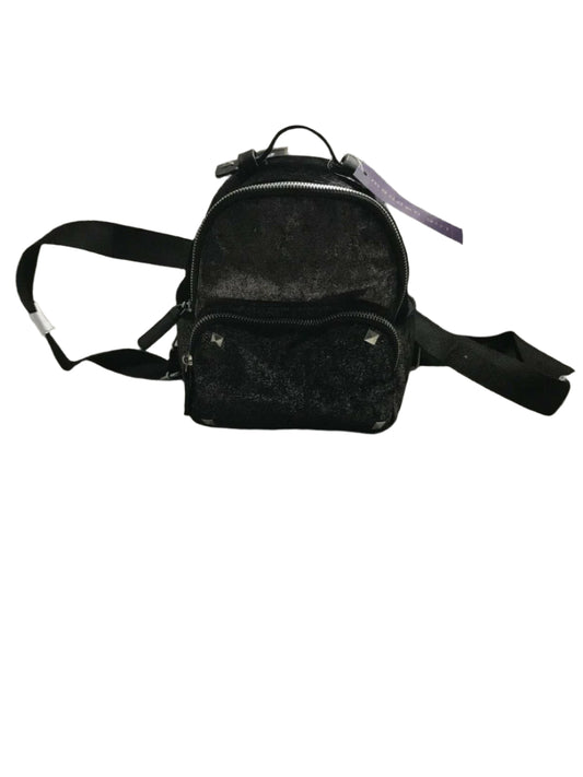 Black faux fur mini backpack with silver tint and front zip pocket with metallic studs