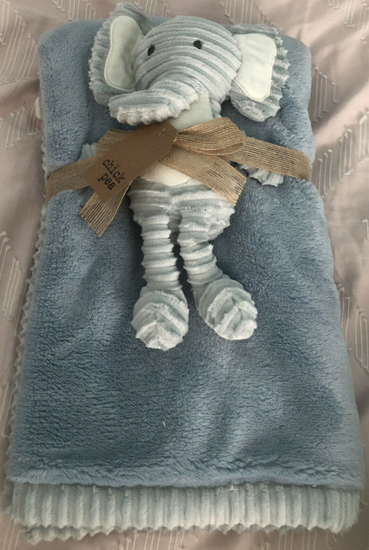 A dark blue baby blanket with a plush toy elephant tied to it with a ribbon.