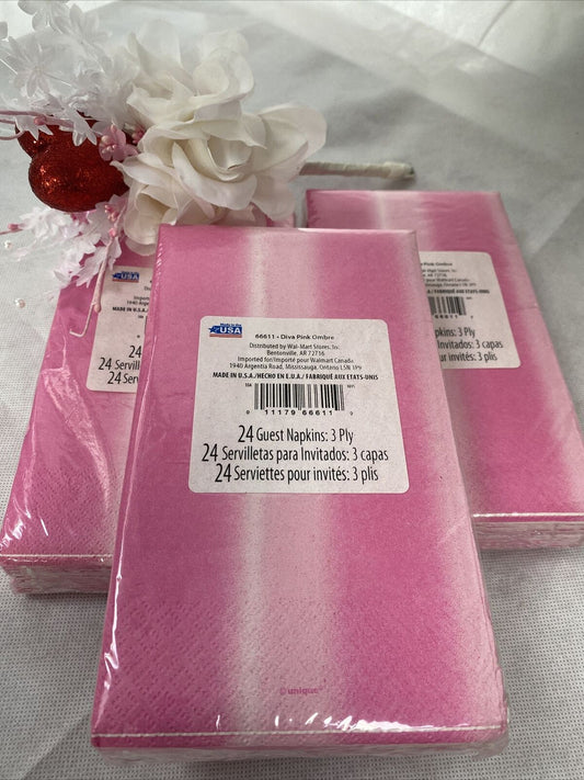 Three packs of pink ombre paper guest napkins wrapped in packaging, 3-ply disposable napkins by Diva made in the USA