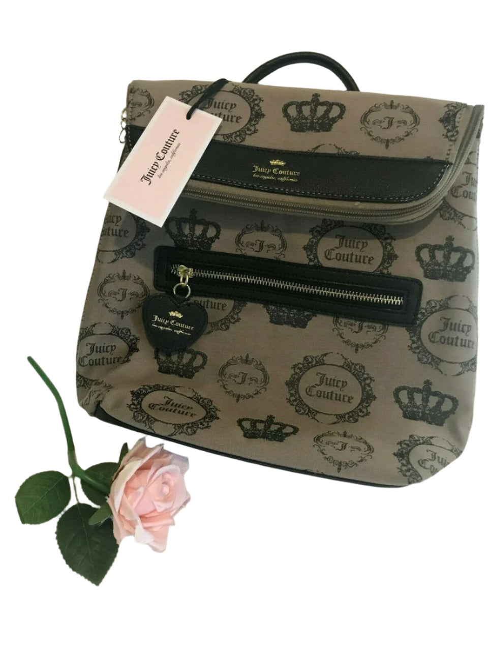 Beige and black canvas backpack with gold Juicy Couture logo and medallion design