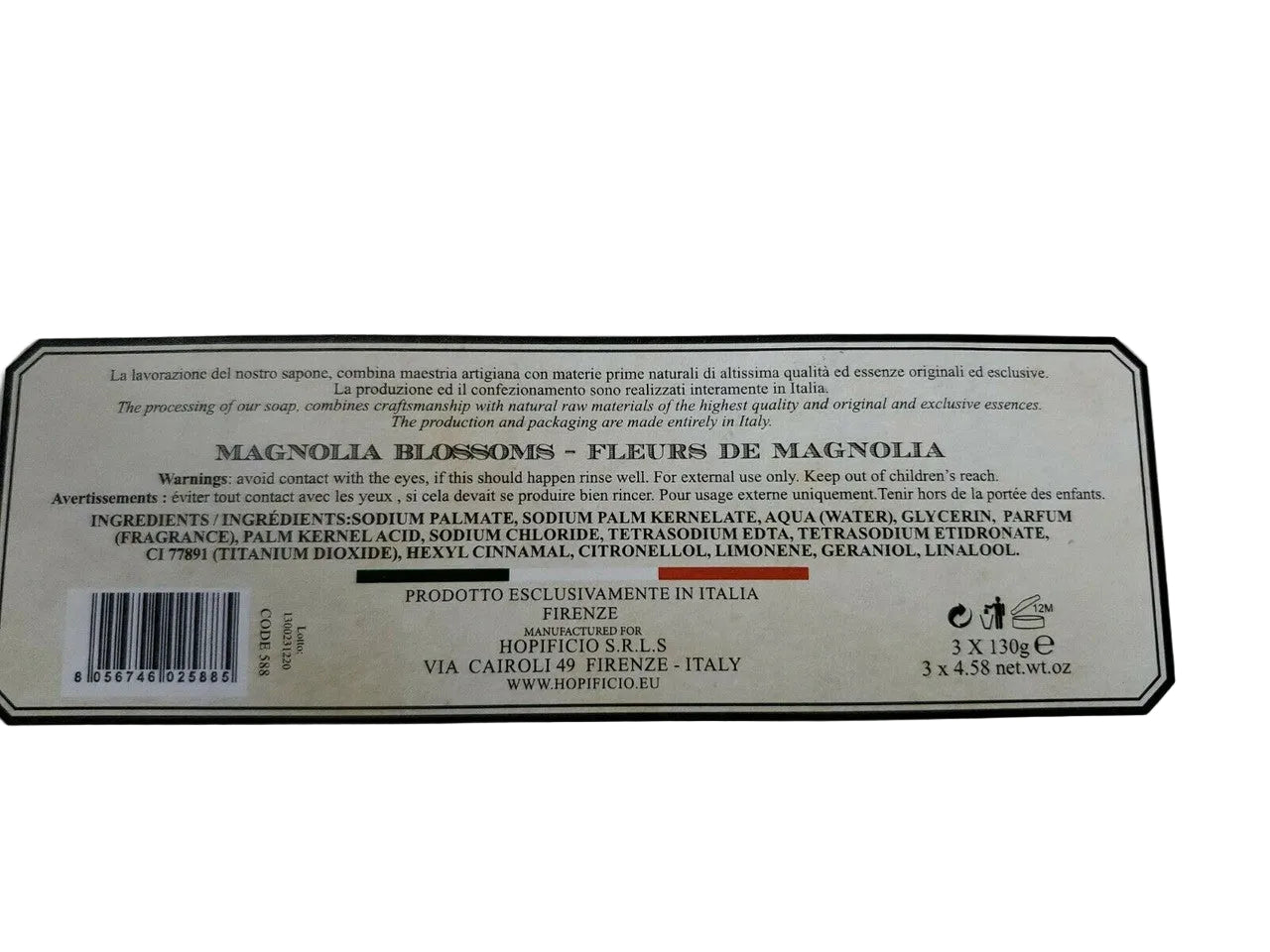Product label with text and a barcode on a white background