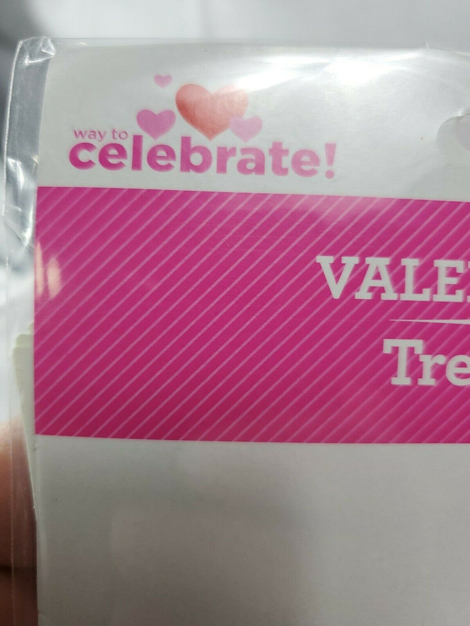 Five Valentine’s Day treat bag packages, each containing five cone-shaped bags with colorful ice-cream design and twist ties.