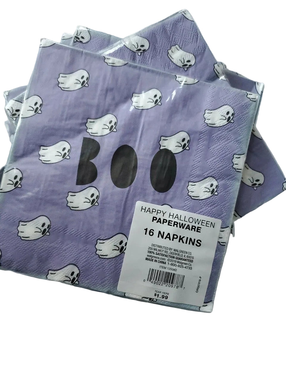 Stack of purple Halloween paper napkins with white ghost and BOO design in packaging