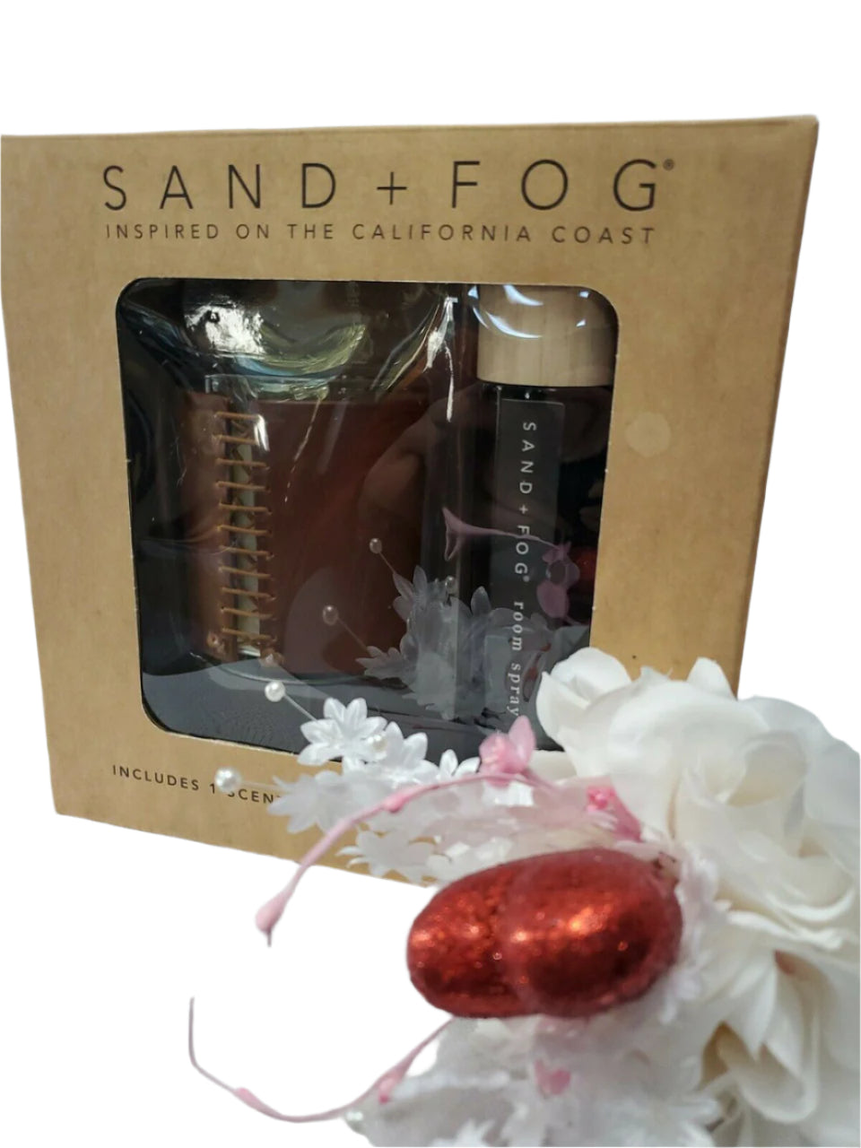 Gift set with Sand + Fog 8 oz teakwood candle and 100 ml room spray in amber containers, boxed for gifting.
