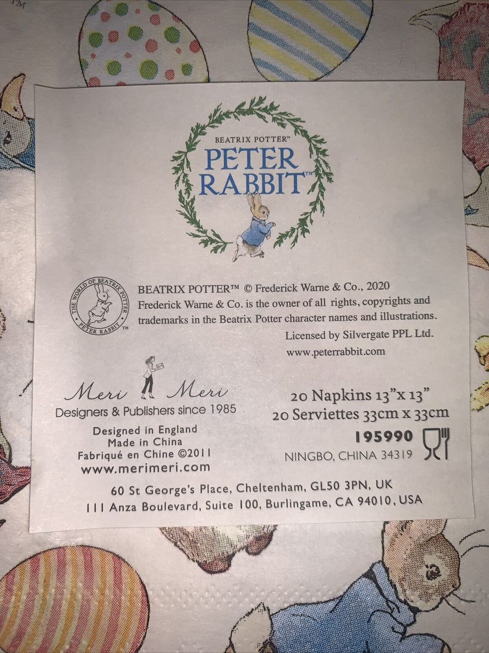 Two packs of Easter cocktail napkins featuring Peter Rabbit illustrations by Beatrix Potter in pastel spring designs