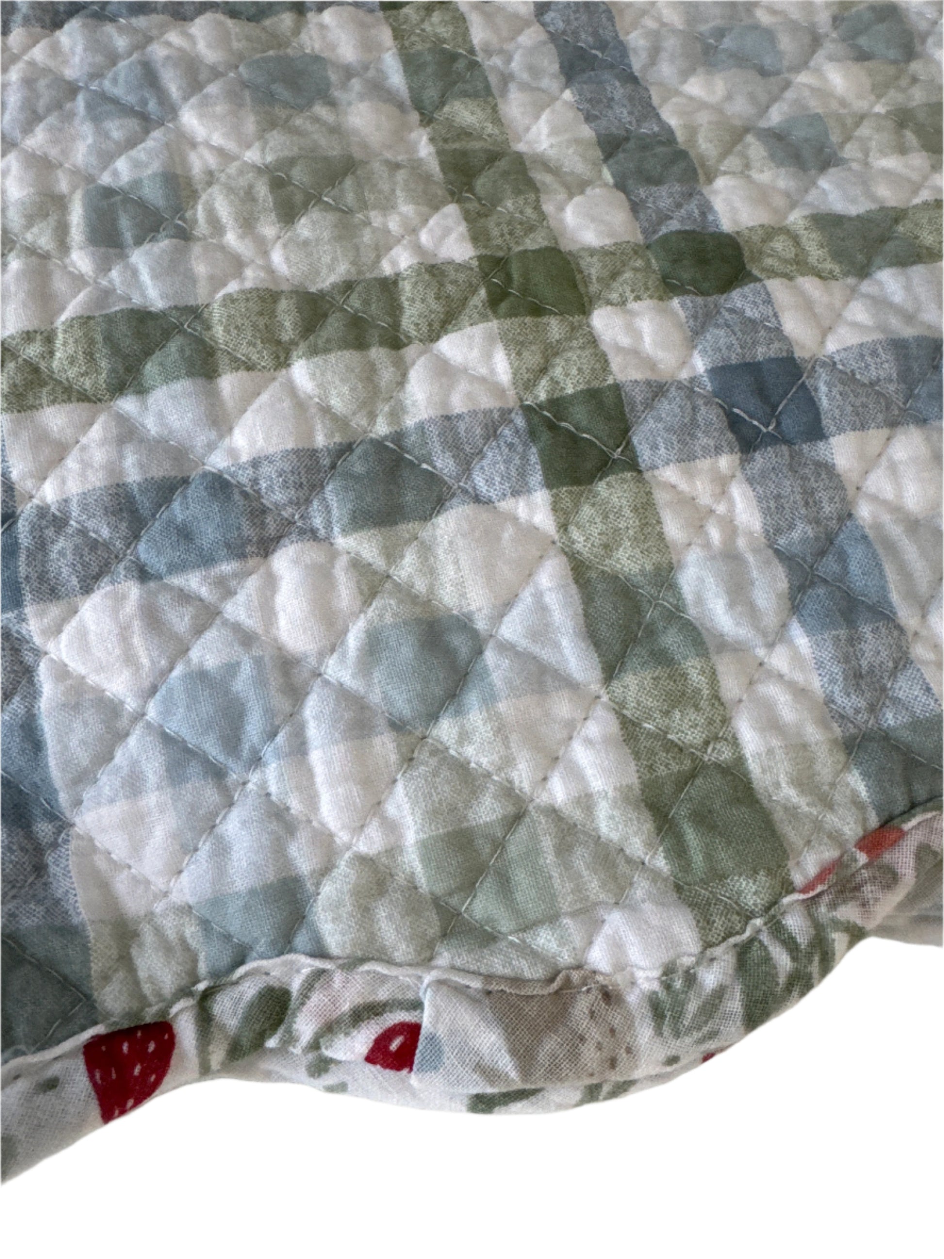 A set of 4 reversible cotton placemats featuring a charming strawberry and floral pattern in red and green, with a scalloped edge. The placemats are packaged with a label reading "Set of 4 Placemat 100% Cotton Shell," measuring 13" x 19"